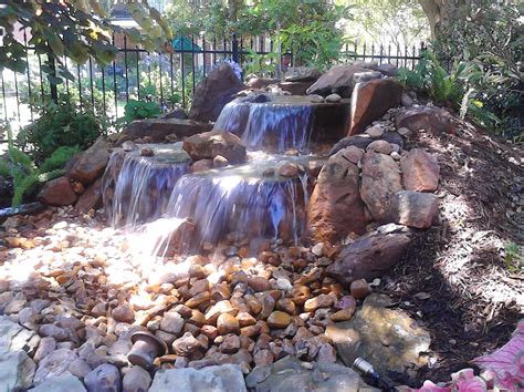 This Unique And Beautiful Pondless Waterfall Was Built Inside The Shell