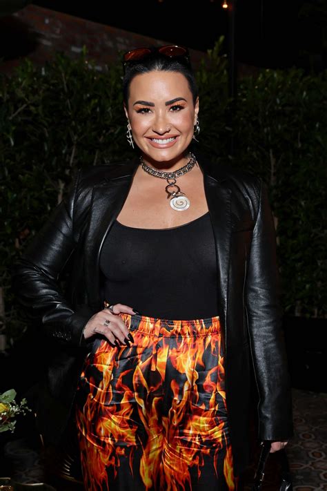 Short Haired Demi Lovato Displaying Her Ample Cleavage At A Random