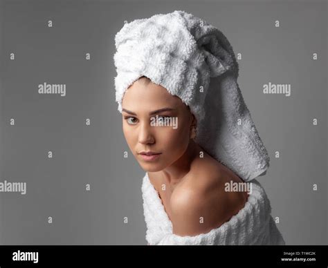 Attractive Girl Wearing White Towel On Head And White Bath Robe