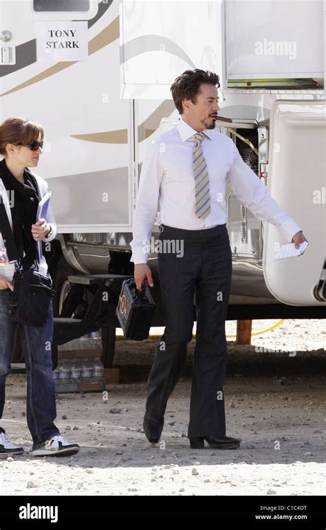 Robert Downey Jr Walking Outside His Trailer Smoking A Cigar Before