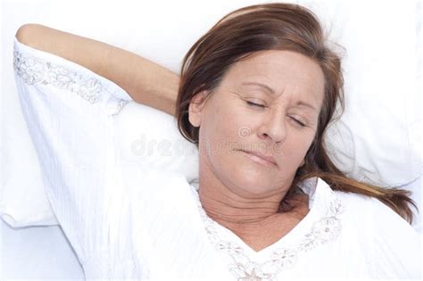 Relaxed Mature Woman Asleep In Bed Stock Photo Image Of Adult Happy