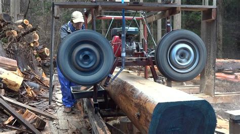 They are the usual 4x6 metal cutting chinese mfg type, a 24 home built bandsaw mill for lumber making, and a 3 wheel duplicarver 24 throat bandsaw that i have owned for 32 years. Homemade band sawmill tire of automobile. I use the axle of the car. - YouTube