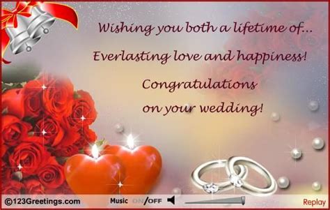 Wedding Card With Two Rings And Red Roses On It Which Reads Wishing