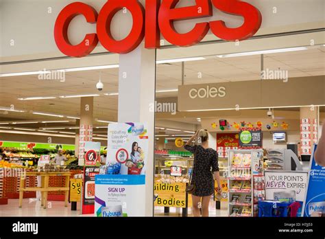 Woman At The Entrance To Coles Supermarket Store In Warriewood Sydney