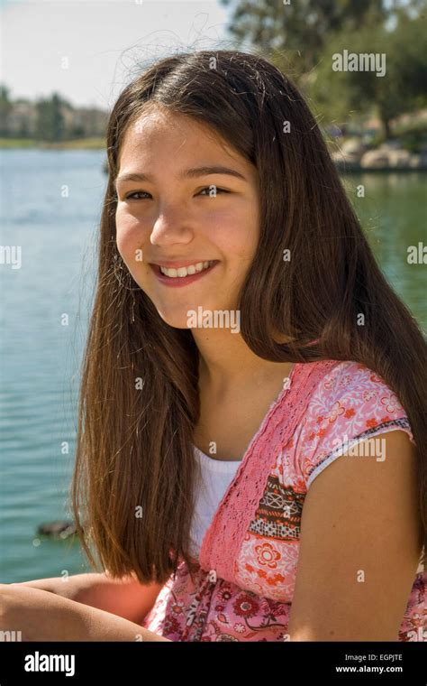 Hispanic Caucasian Teen Girl 11 13 Year Old Smiling Portrait In Park