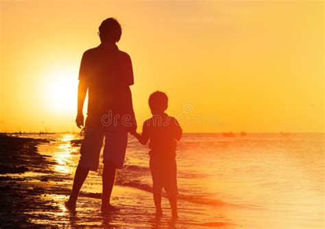 Father And Son Holding Hands At Sunset Stock Photo Image Of Summer