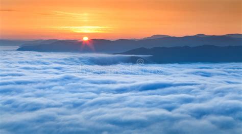 Sunrise Over The Sea Of Fog Stock Photo Image Of Mist Light 39087044