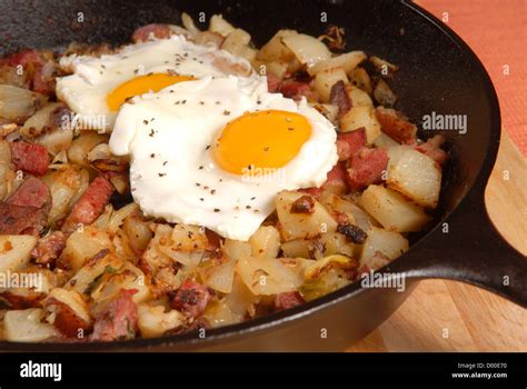 Southern Breakfast Of Corned Beef Hash And Sunny Side Up Eggs Stock