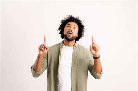Advertising Concept Surprised African American Guy In Shirt Points