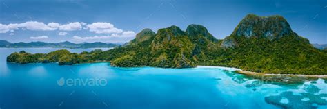 Aerial Drone Panoramic View Of Uninhabited Tropical Island With Rugged