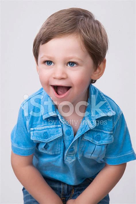 Boy Smiling In Blue Shirt Stock Photo Royalty Free Freeimages