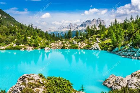 Turquoise Sorapis Lake In Cortina Dampezzo With Dolomite Moun Stock