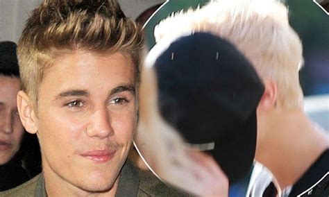 Justin Bieber Tries To Hide His Newly Bleached Platinum Blonde Hair