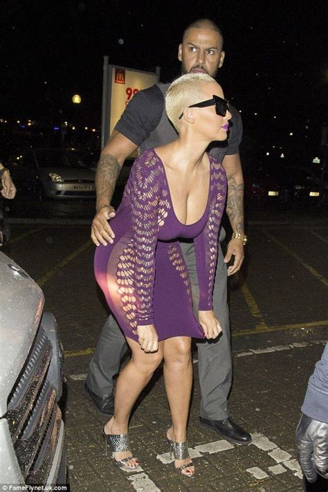 Amber Rose Shows Off Her Ample Assets In Plunging Purple
