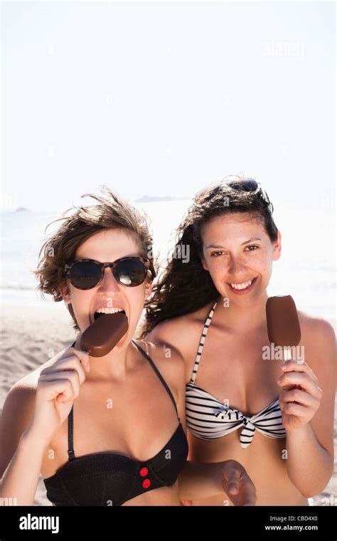Women Eating Ice Cream On Beach Stock Photo Alamy