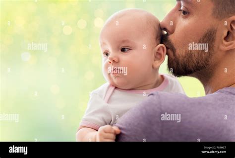 Close Up Of Father Kissing Little Baby Daughter Stock Photo Alamy