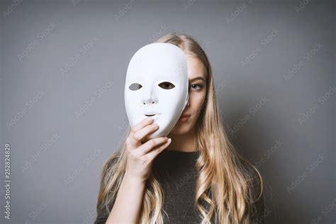 Teen Girl Hiding Her Face Behind Mask Identity Or Personality Concept