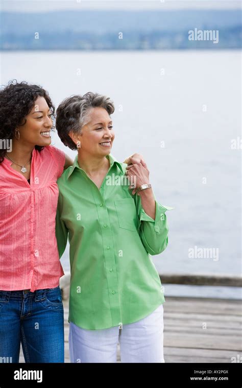 African American Mother And Adult Daughter Hugging Stock Photo Alamy