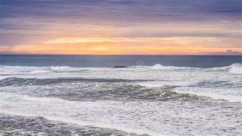 Wide Shot Of A Beautiful Sea Under A Cloudy Sky Stock Photo Image Of