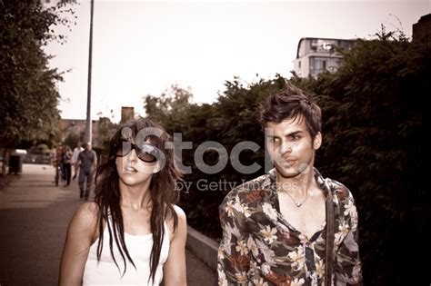 Young Couple Walking Down The Street Stock Photo Royalty Free