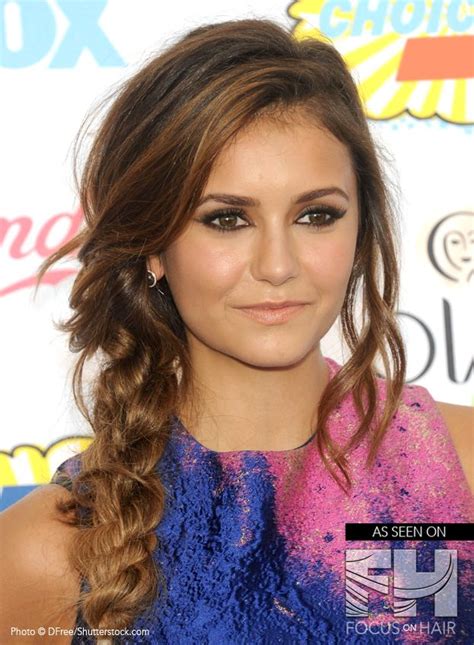 nina dobrev flaunts a messy side hairstyle that is an undone version of a rope braid