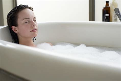 Young Woman Relaxing In Bubble Bath Eyes Closed Lepoticars