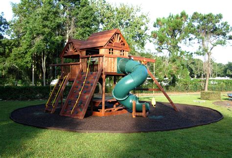 The backyard offers a world of fun for children. B Safe Rubber Mulch
