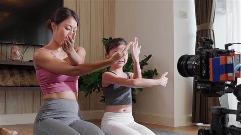Asian Yoga Instructor And Babe Create Online Classes For Healthy Living Fitness On Social