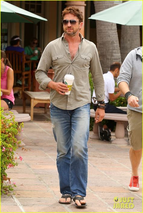 gerard butler scopes out surf gear after kissing session with mystery girl photo 3169583