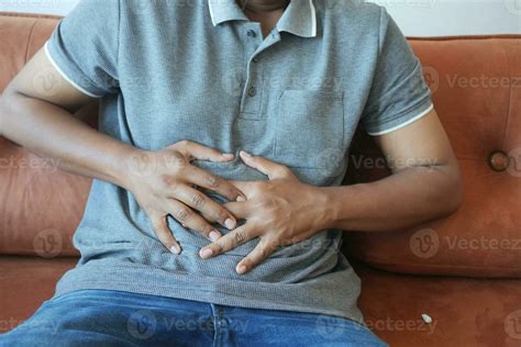 Young Man Suffering Stomach Pain Close Up 31824449 Stock Photo At Vecteezy