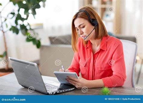 Woman With Headset And Laptop Working At Home Stock Photo Image Of Application Operator