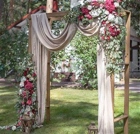 Beautiful Wedding Ceremony Backdrop Arbor With Draping Flowers And