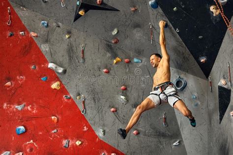 Panoramic Man Bouldering At An Indoor Climbing Centre Stock Image