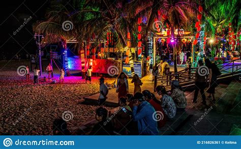 Nightlife In Sanya With View Of The Entrance Of A Bar With People On