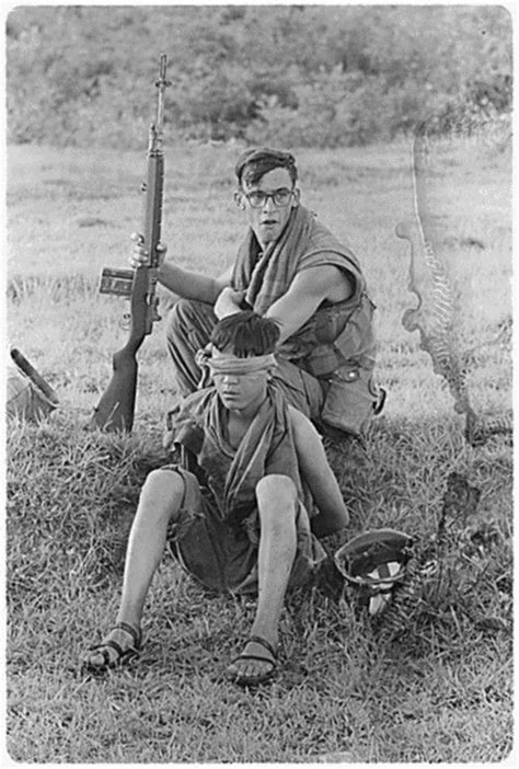 Us Soldier Guards An Nva Soldier He Captured During A Ground Movement