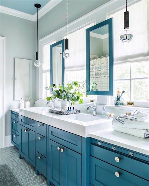 Teal tiles together with the marble sink and iron cranes ensure the. teal 💙 | Transitional bathroom design, Blue bathroom ...