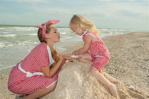 Mother And Her Daughter Having Fun On The Beach Stock Image Image Of