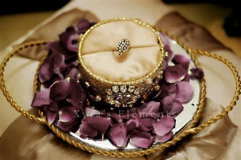 Indian marriages are not just a match for the couples but also a match of the two families. beautiful ring tray | Indian wedding rings, Afghan wedding ...