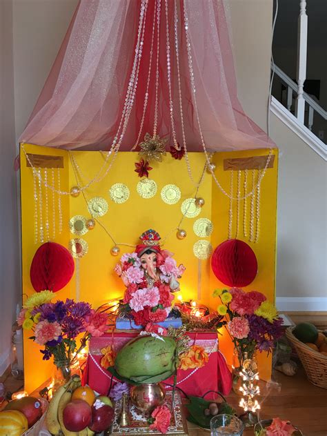There Is A Small Shrine With Flowers And Decorations