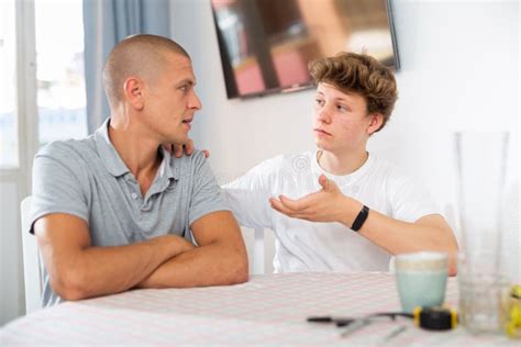 Dad And Teenager Son Having Conversation Stock Photo Image Of