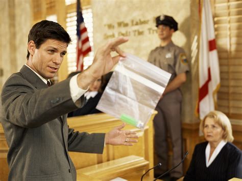 male lawyer displaying evidence to jury trial theater secrets for courtroom success