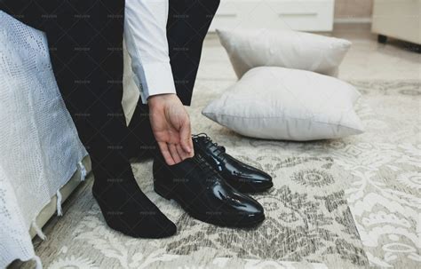 Man In A Suit Putting On His Shoes Stock Photos Motion Array