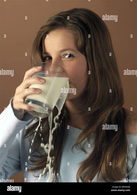 teenagers girl glass milk drink spills portrait series people youth teenagers 14 years watching