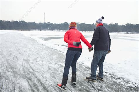 Couple Ice Skating Holding Hands Stock Image F009 9330 Science Photo Library