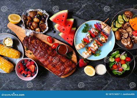 Bbq Or Summer Picnic Food Table Scene Over A Dark Stone Background