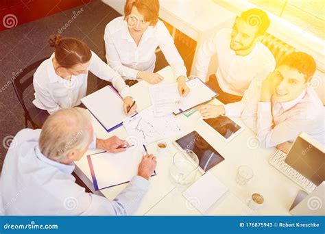 Businesspeople Working At Table In Conference Room Stock Image Image