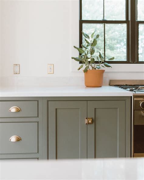 The combination of sage green cabinets and tile creates a timeless kitchen backsplash. christine on Instagram: "CABINET HARDWARE. IS. EVERYTHING ...
