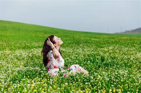 A Beautiful Woman Sitting In A Green Clearing In Nature Stock Image Image Of Breed Happy