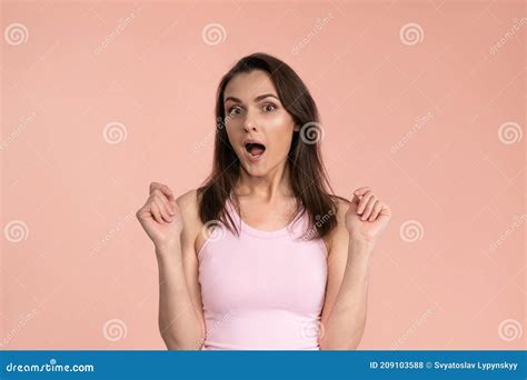 Acting Young Woman Expressing Omg Wearing Pink T Shirt With Hands On