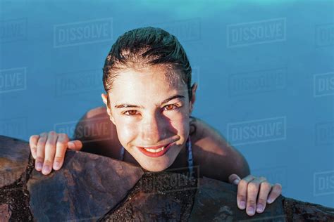 High Angle Portrait Of Wet Smiling Girl At Poolside Stock Photo Dissolve